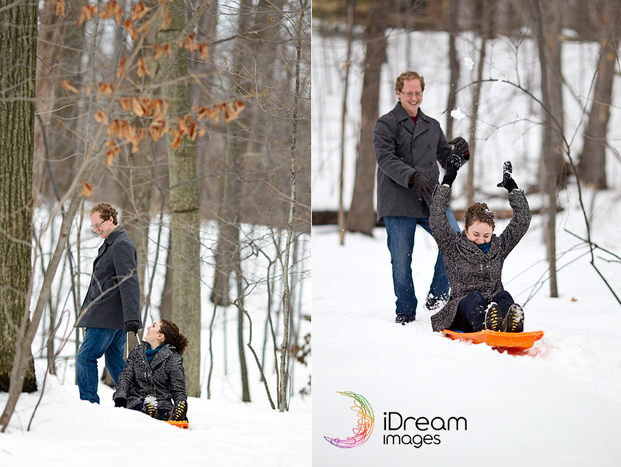 Engaged couple sled riding